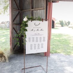 hanging sign board on copper frame in barn