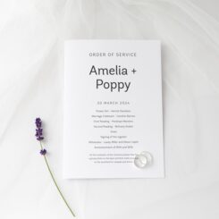Front and back of printed poem keepsake next to lavender flowers