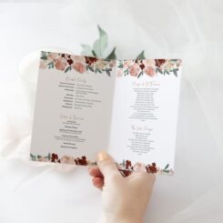 flowers bordering text on printed order of service folded open