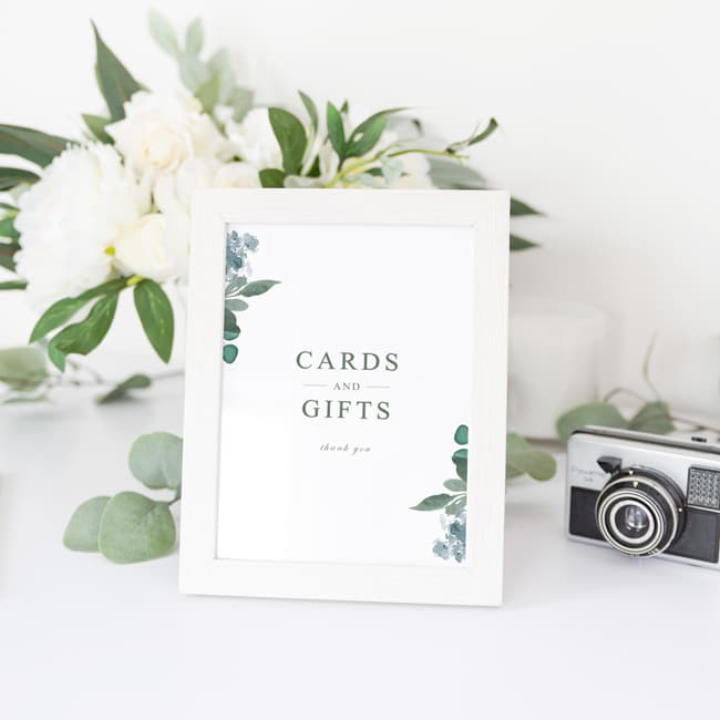small printed sign in frame that says cards and gifts